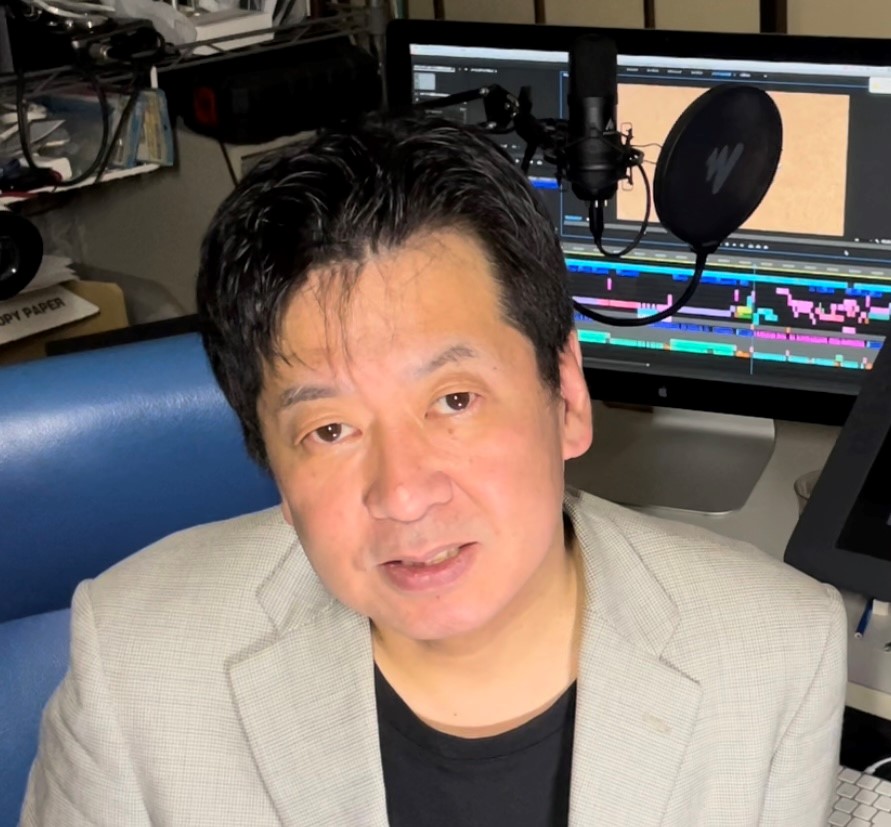 Kazushige Yusa sitting in an animation studio